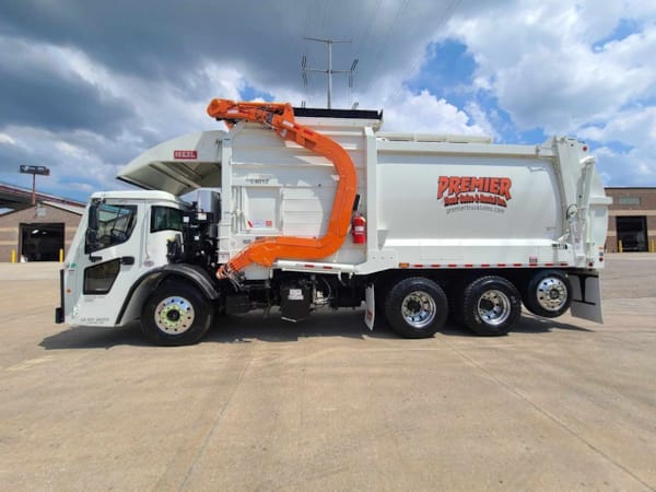 Mack LR64R residential front loader garbage truck left side